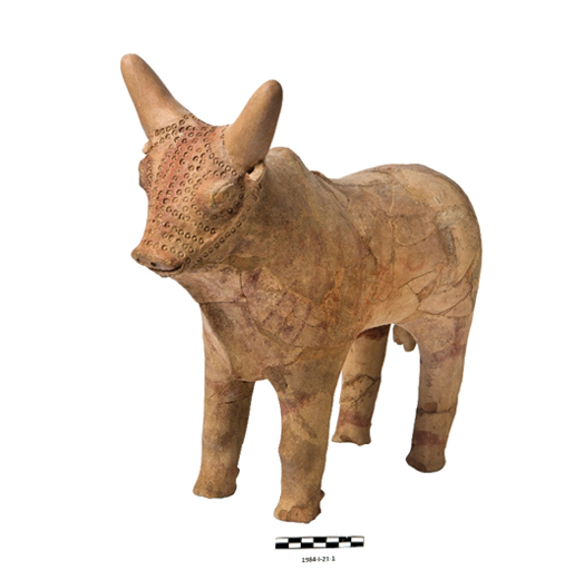 A brown clay statue of a bull with a white spot on its head.

AI generated content